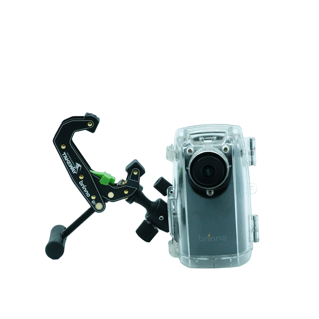 A clear waterproof camera housing with a mounted black tripod bracket and small green accent, shown on a clean white studio background.