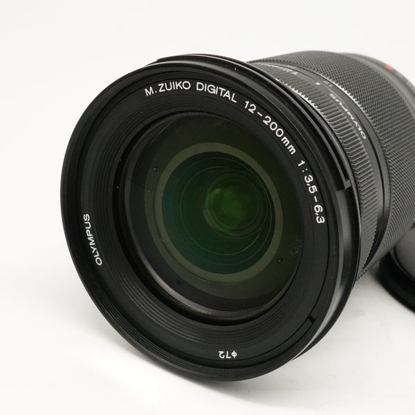 Pre-Owned OM System M.ZUIKO 12-200mm F3.5-6.3 Black lens With F&R Caps, Hood SN: 350013148 (Second Hand)