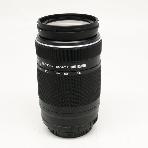 Pre-Owned OM System M.ZUIKO Digital ED 75-300mm f/4.8-6.7 Lens With F&R Caps, Hood SN: 343110376 (Second Hand)