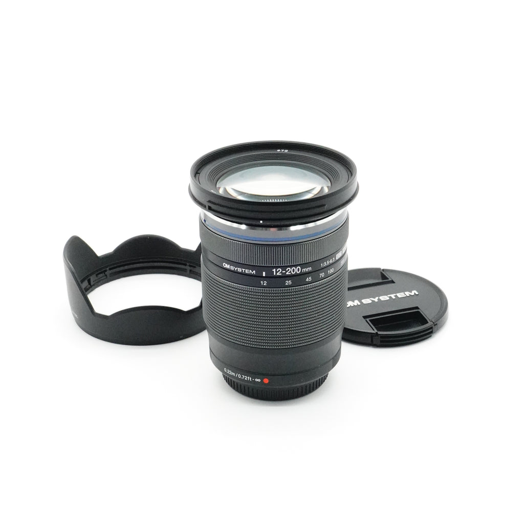 Pre-Owned OM System M. ZUIKO Digital 12-200mm f/3.5-6.3 ED MSC Lens With Caps & Hood SN: 350022589 (Second Hand)