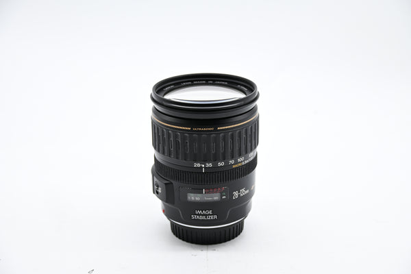 Pre-owned Canon EF 28-135mm f/3.5-5.6 IS USM Lens w/caps & Hood SN: 83002382