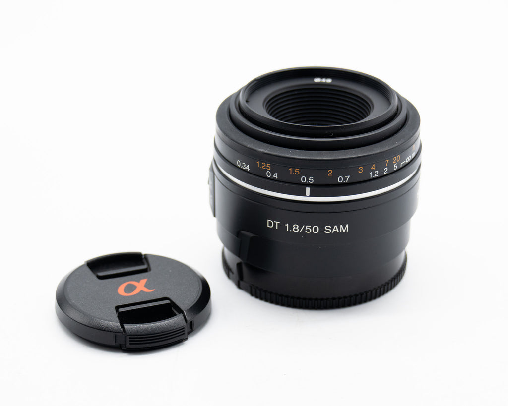 Pre Owned Sony SAL 50mm f1.8 DT SAM OSS Lens W/ F,R Caps SN: 1957112